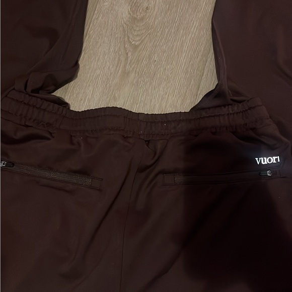 Vuori Men's Sunday Performance Joggers in a brown/oxblood color. - Picture 3 of 5